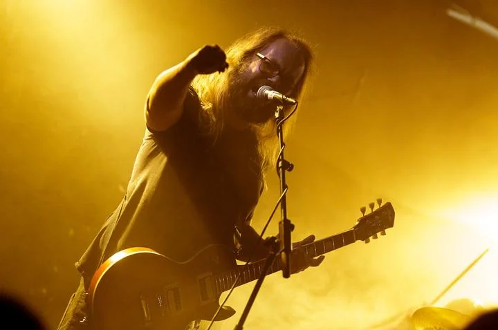 Doomherre performing live on stage, Victor Takala on guitar
