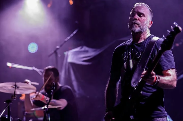 Daniel Strachal behind the drums at a Doomherre concert